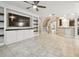 Open living area with tile flooring, fan, and staircase access to other floors at 3530 Brook Crossing Dr, Brandon, FL 33511