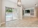 Spacious living area with tile floors, access to a pool, and a media center at 3530 Brook Crossing Dr, Brandon, FL 33511