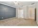 Large main bedroom with an en-suite bathroom, large closet space, carpeted floors, and accent wall at 3530 Brook Crossing Dr, Brandon, FL 33511