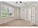 Bright office with neutral carpet and large window. Glass paneled doors provide access at 3530 Brook Crossing Dr, Brandon, FL 33511