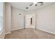 Well-lit office with ceiling fan, French doors, and carpet flooring at 3530 Brook Crossing Dr, Brandon, FL 33511