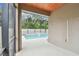 A covered outdoor space showcases a pool and a screened enclosure for backyard retreat at 3530 Brook Crossing Dr, Brandon, FL 33511