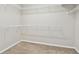 Carpeted walk-in closet featuring ample storage with wire shelving and neutral-colored walls at 3530 Brook Crossing Dr, Brandon, FL 33511