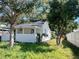 Charming exterior view of this cozy home, showing its well-maintained white siding and inviting front porch at 368 6Th Nw St, Largo, FL 33770