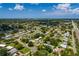 Overhead shot of a neighborhood highlighting a property with a fenced backyard, in-ground pool, and lush tree coverage at 3700 56Th N St, St Petersburg, FL 33710