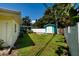Backyard featuring a lawn, shed, fence, trees and an AC unit at 3700 56Th N St, St Petersburg, FL 33710