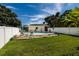 This backyard features a delightful pool area, complemented by a well-kept lawn and surrounded by a privacy fence at 3700 56Th N St, St Petersburg, FL 33710