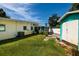 Green backyard featuring lawn and a shed with a small patio at 3700 56Th N St, St Petersburg, FL 33710