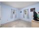 Clean bedroom with carpet, light blue walls, and two windows at 3700 56Th N St, St Petersburg, FL 33710