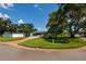 Charming home with lush landscaping, mature trees, a well-manicured lawn and convenient street access at 3700 56Th N St, St Petersburg, FL 33710
