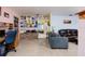Open-concept living room with unique decor, a cozy seating area, and bright, airy feel at 3700 56Th N St, St Petersburg, FL 33710