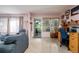 Cozy living room featuring a desk area, neutral walls, and a view of the front yard at 3700 56Th N St, St Petersburg, FL 33710