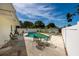 Inviting backyard with a sparkling pool, lounge chairs, and an outdoor dining set, perfect for relaxation and entertaining at 3700 56Th N St, St Petersburg, FL 33710