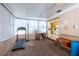 Sun room with a treadmill, desk and a view into the kitchen at 3700 56Th N St, St Petersburg, FL 33710