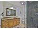 Bathroom with glass bowl sink, granite countertop, and modern shower at 3836 N Lake Dr # 121, Tampa, FL 33614