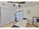 This bedroom features a massage table, a window with natural light, and closet storage at 3836 N Lake Dr # 121, Tampa, FL 33614