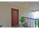 Inviting entryway featuring front door, quaint railing, and a potted plant at 3836 N Lake Dr # 121, Tampa, FL 33614