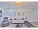 Cozy living room with a white sofa, modern art, and ample natural light, creating a welcoming atmosphere at 3836 N Lake Dr # 121, Tampa, FL 33614
