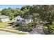 Bird's eye view featuring the home's fenced yard, driveway, and mature tree coverage at 4112 E Ellicott St, Tampa, FL 33610