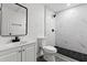 This remodeled bathroom offers a glass-enclosed shower and modern sink at 4112 E Ellicott St, Tampa, FL 33610