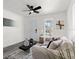 Bright living room with modern decor, ceiling fan, and hardwood floors, creating a welcoming space at 4112 E Ellicott St, Tampa, FL 33610