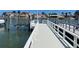 Beautiful view of a private boat dock on a clear, sunny day at 587 Boca Ciega Point N Blvd, St Petersburg, FL 33708