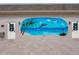 Exterior of building with ocean mural, and two doors on either side, and brick paved entry at 587 Boca Ciega Point N Blvd, St Petersburg, FL 33708