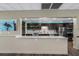 Well-equipped kitchen with modern appliances and dark wood cabinetry, ideal for culinary enthusiasts at 587 Boca Ciega Point N Blvd, St Petersburg, FL 33708