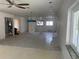 Unfinished living room with ceiling fan, recessed lights, and view of HVAC unit at 587 Boca Ciega Point N Blvd, St Petersburg, FL 33708
