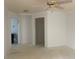 Bright living room with ceiling fan and view of the backyard at 587 Boca Ciega Point N Blvd, St Petersburg, FL 33708