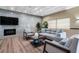 Comfortable living room with grey seating, modern fireplace, and stylish decor for relaxation at 587 Boca Ciega Point N Blvd, St Petersburg, FL 33708