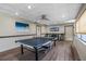 Fun recreation room with a ping pong table and games, perfect for entertainment and leisure at 587 Boca Ciega Point N Blvd, St Petersburg, FL 33708