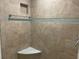 Corner shower with stylish tile work, including a bench and recessed shelf at 587 Boca Ciega Point N Blvd, St Petersburg, FL 33708