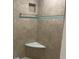 Corner shower with stylish tile work, including a bench and recessed shelf at 587 Boca Ciega Point N Blvd, St Petersburg, FL 33708