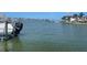 Scenic view of the waterfront with boat and Mercury outboard motor at 587 Boca Ciega Point N Blvd, St Petersburg, FL 33708