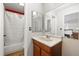 Bathroom showing a vanity and a tub with shower at 7608 Pasa Dobles Ct, Tampa, FL 33615