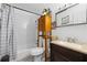 Bathroom with a shower and tub combination, vanity, and modern fixtures at 7608 Pasa Dobles Ct, Tampa, FL 33615