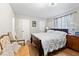 Comfortable bedroom showcasing hardwood floors and classic furnishings at 7608 Pasa Dobles Ct, Tampa, FL 33615