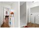 Hallway with laundry room featuring a washer and dryer, providing convenience and functionality at 7608 Pasa Dobles Ct, Tampa, FL 33615