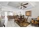 Bright, open living and dining area with tile floors, and a ceiling fan at 7608 Pasa Dobles Ct, Tampa, FL 33615