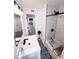 Modern bathroom featuring a combo tub/shower, patterned tile floors, and a vanity sink at 811 40Th S Ave, St Petersburg, FL 33705
