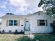 Charming single-story home featuring a new roof, fresh exterior paint, decorative shutters and landscaped yard at 811 40Th S Ave, St Petersburg, FL 33705