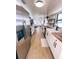Updated kitchen featuring white cabinetry, modern appliances, open shelving, and wood countertops at 811 40Th S Ave, St Petersburg, FL 33705