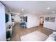 Open floor plan featuring living room area adjacent to the kitchen with wood-look floors and recessed lights at 811 40Th S Ave, St Petersburg, FL 33705