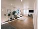 Bright living room with wood-look floors, recessed lights, and large windows that provide ample natural light at 811 40Th S Ave, St Petersburg, FL 33705