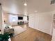 Spacious living room with wood-look floors, recessed lights, and large windows that provide ample natural light at 811 40Th S Ave, St Petersburg, FL 33705
