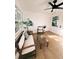 Bright sunroom featuring wood-look floors, neutral walls, and a cozy seating area with bright, natural lighting at 811 40Th S Ave, St Petersburg, FL 33705