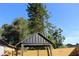 Backyard showcasing a gazebo with new wooden fence at 8524 Fish Lake Rd, Tampa, FL 33619