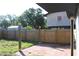 Fenced backyard with brick patio and wood fence at 8524 Fish Lake Rd, Tampa, FL 33619