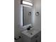 Bathroom featuring backlit mirror, sleek faucet, and stylish fixtures at 8524 Fish Lake Rd, Tampa, FL 33619